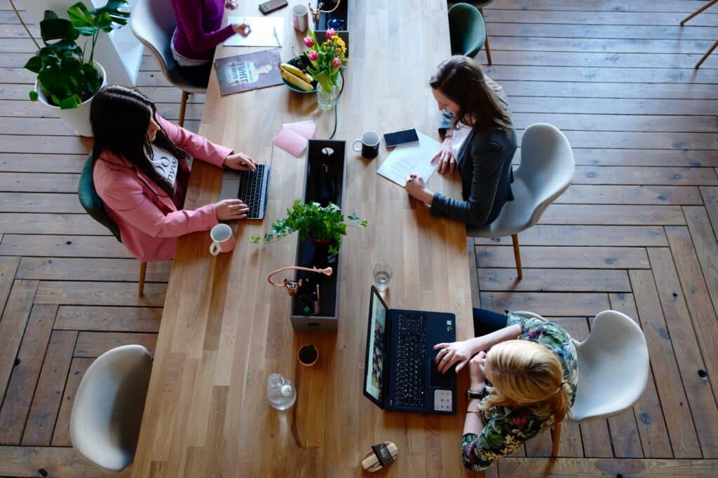 Employees Working In A Coworking Space