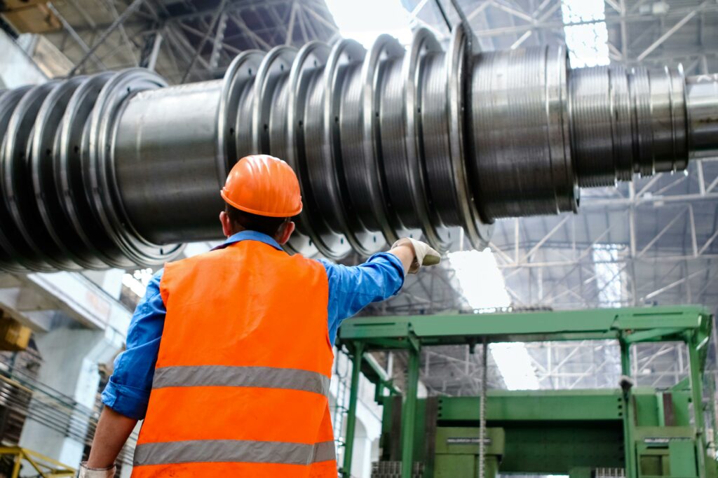 Worker Exploring Manufacturing Equipment