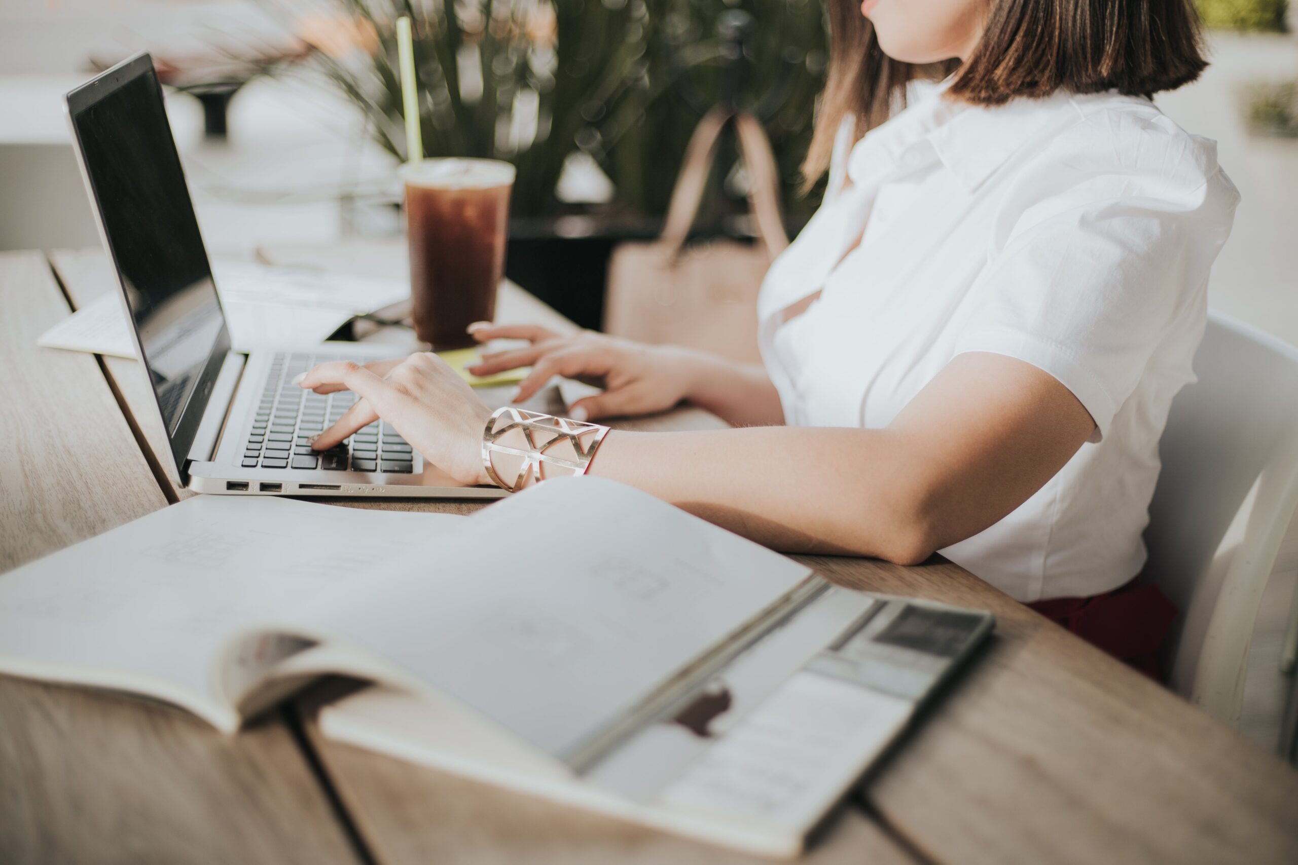 A Person Working At A Desk Streamlining Dynamics 365 Training Costs