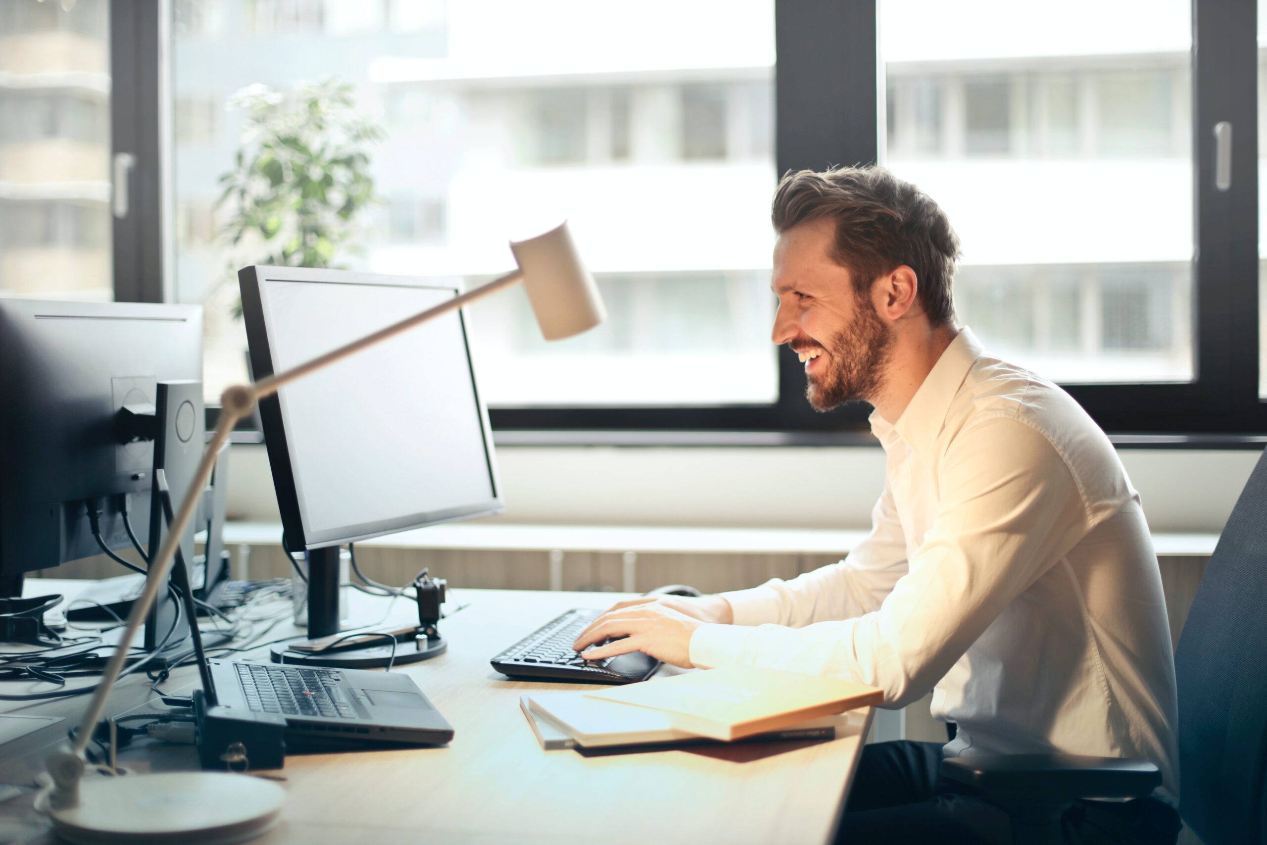 Man Creating D365 Ce Training Materials At A Desk