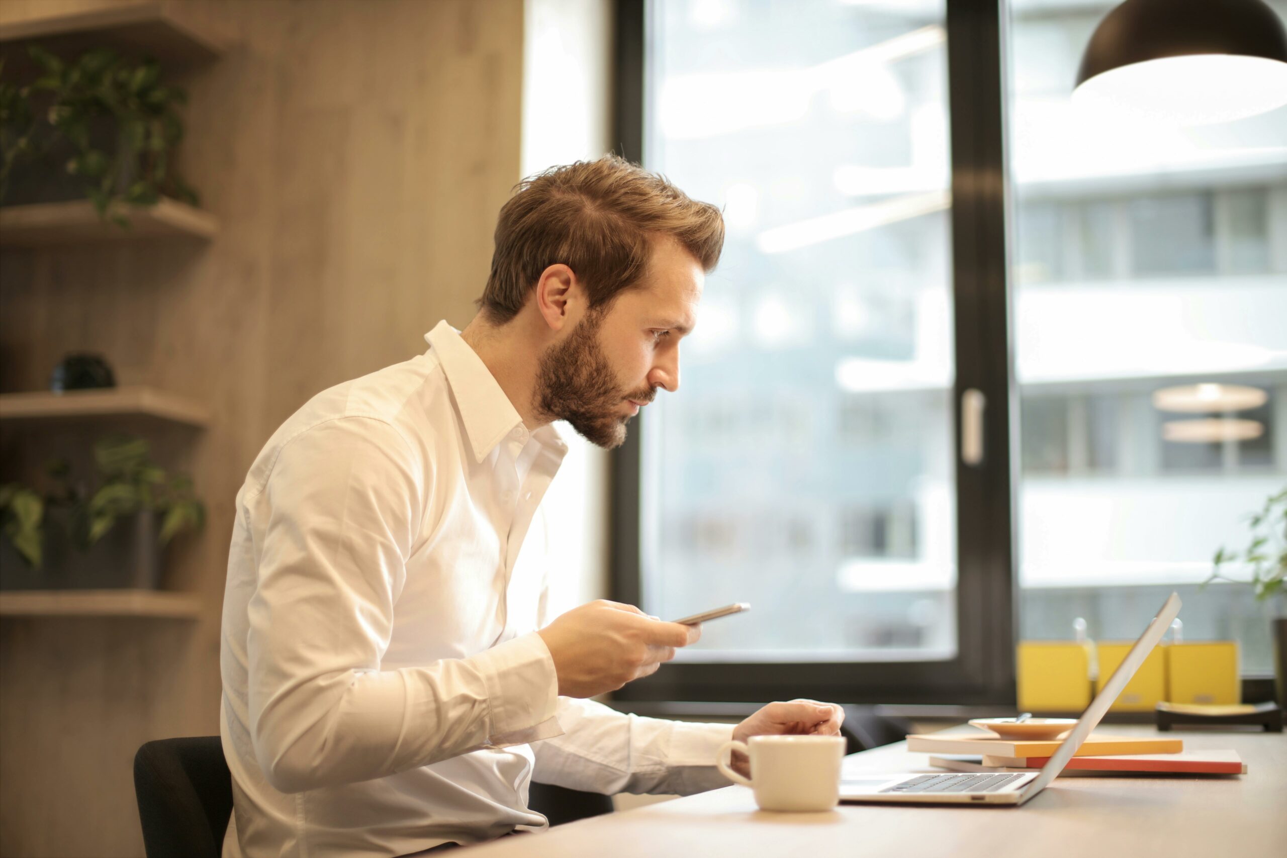 Man In A Meeting At His Desk